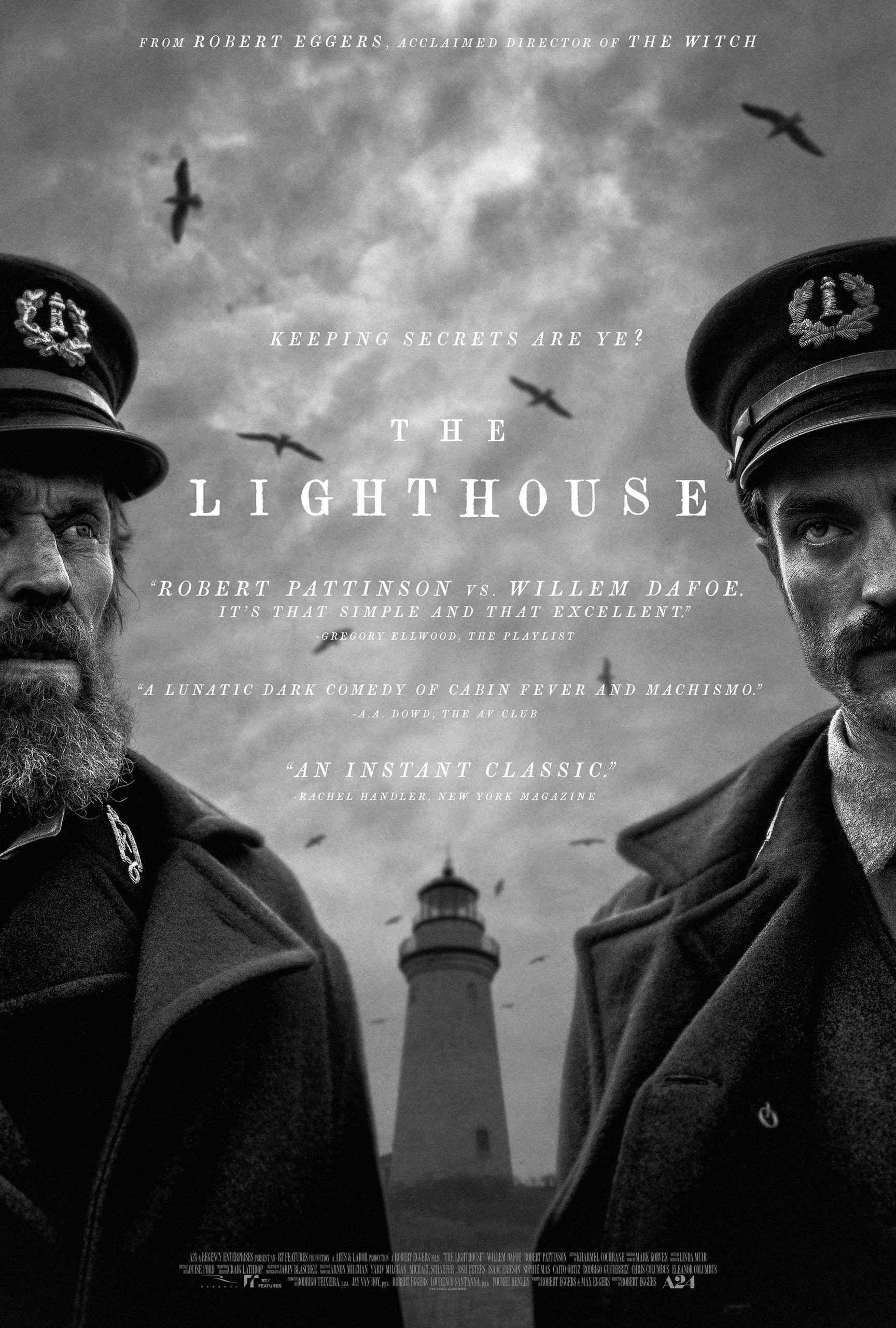 Image of the movie poster for "The Lighthouse," showing Thomas and Ephraim, played by Willam Defoe and Robert Pattinson respectively, stand before the lighthouse, with the title and credits centered.