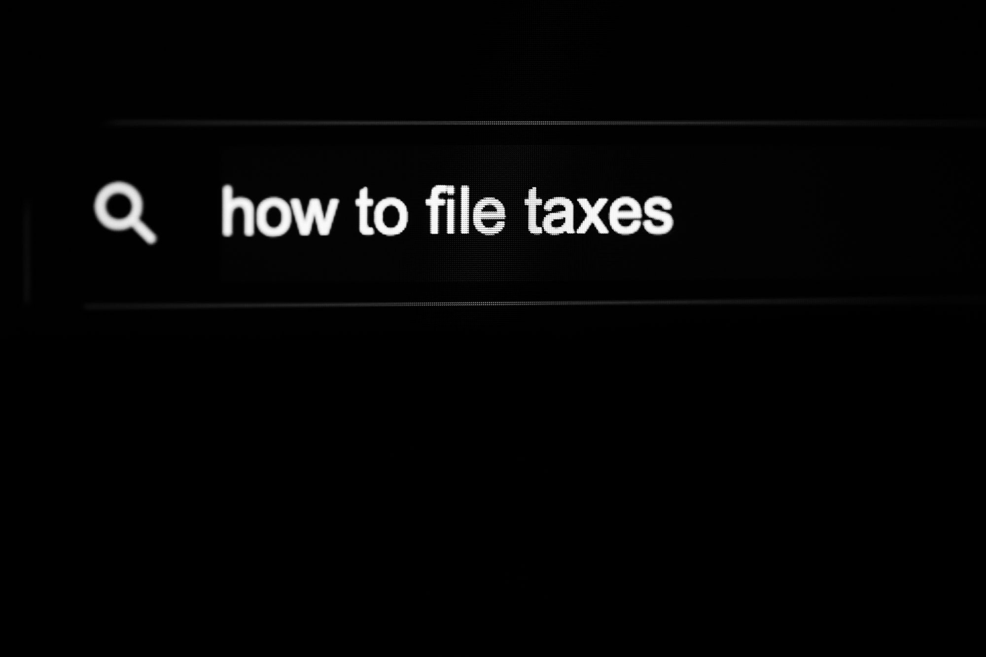 Image of Google Search Bar with "how to file taxes" written in it.