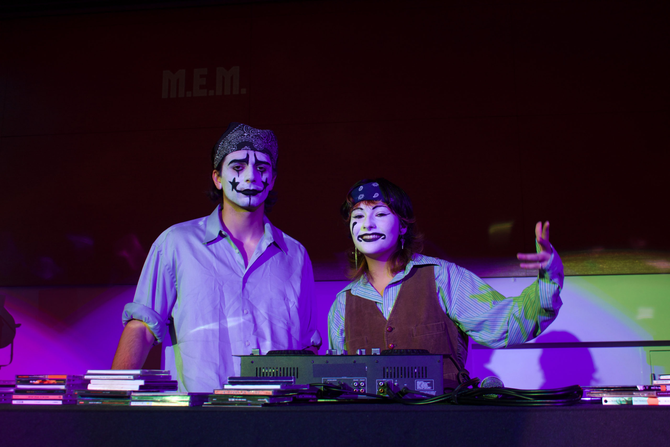 Two DJ's pose for a picture in their ghoulish makeup.